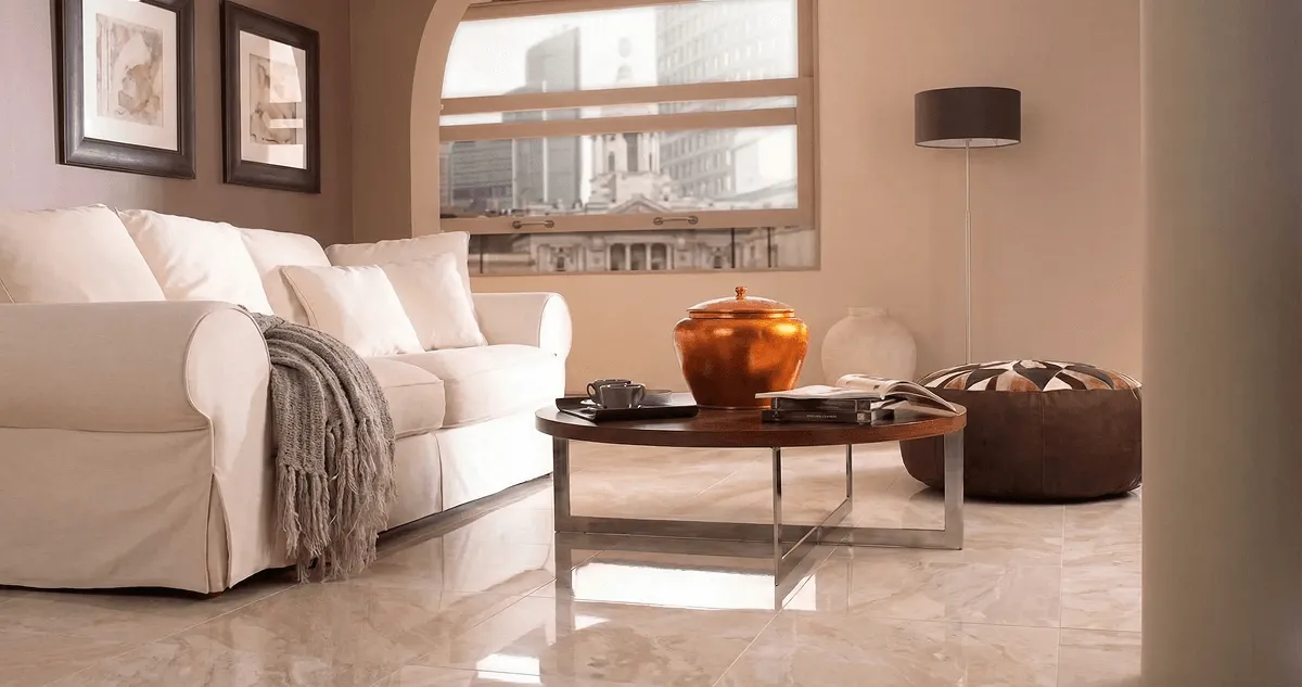 Modern living room with professionally installed marble flooring, a beige sofa, coffee table in Jacksonville, FL