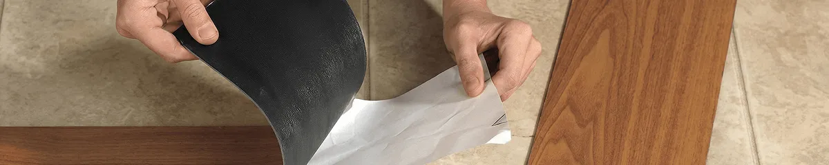 A professional installing vinyl flooring in Jacksonville, FL